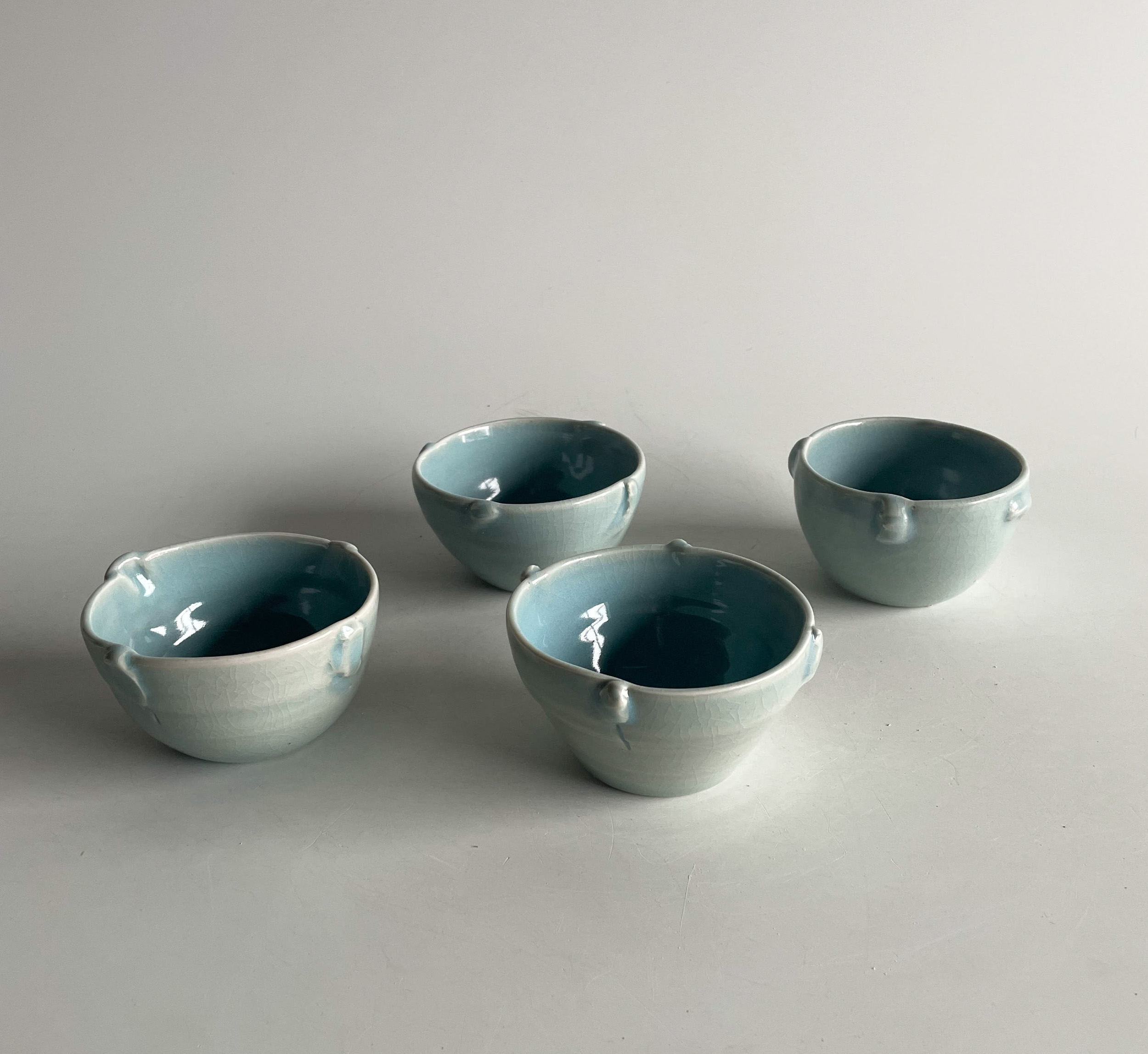 set of four unique porcelain bowls by Luis Roldán from theMUST.co. Color light blue.