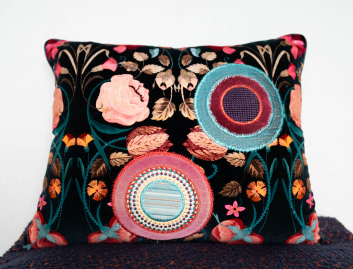 Colorful hand-embroidered cushion